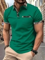 Detail of green men's Polo shirt with brown plaid collar and pocket on city street - S / Green