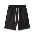 Detailed view of black drawstring shorts featuring reinforced X-stitch on white cords - Black
