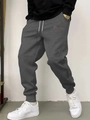 Detail of dark grey joggers with BLACK lettering, drawstring waist, and ribbed cuffs - S / BLACK Print-Dark Gray