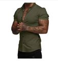Close-up of slim fit olive green short sleeve shirt with black buttons on a model - S / Tops / Olive Green