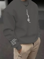 Détail du lettrage blanc manuscrit sur la poitrine d'un sweat-shirt gris foncé col rond - XS / Gris Foncé (Mayhem)