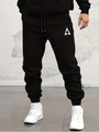 Detail showing the white triangle logo on these black cotton joggers for men - S / Triangle Geometric Logo-Black