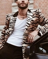 Detail of tiger print fuzzy blazer with pearl necklace and silver cross earring - 3XL / Tops / Tiger Pattern (XF42)