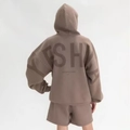 Detailed back view of a dark brown oversized hoodie with large YESHA foam letter printing - Brown (YESHA Print)