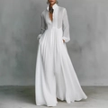 Détail de la robe longue blanche à manches longues avec taille haute et plis élégants - Blanc
