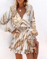 Detailweergave van de boho-print met V-hals en elastische taille op de jurk met lange mouwen - S / Khaki