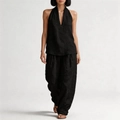Detail of minimalist black linen two-piece set featuring halter neck top and wide leg pants - S / Black