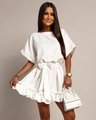 Detail of white ruffled mini dress with bow tie waist and short sleeves on model - White