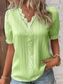 Close-up of light green V-neck top featuring delicate white lace trim and textured fabric - Yellow-Green / S