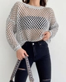 Detail shot of grey hollow crochet knit texture and breathable mesh pattern on loose sweater - S / Gray