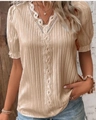 Detailed view of champagne blouse featuring V-neck lace trim and pleated texture fabric - Apricot