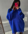 Detail of royal blue oversized knit sweater featuring distressed holes and fringed edges - Blue