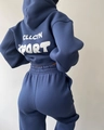 Detail view of navy blue hooded tracksuit with white CLLCTN SPORT print on the back - S / Blue