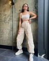 Detail of high waist cargo pants and ribbed tank top set with functional pockets - S / Apricot