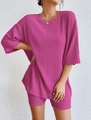 Detailed macro view of the ribbed knit fabric and stitching on the pink two-piece set - S / Rose Red