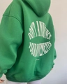 Detail view of the green hoodie back featuring white circular letter print design - S / Green