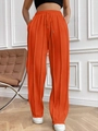 Détail d'un pantalon de jogging taille haute orange vif avec cordon et plis verticaux - S / Rouge Orangé