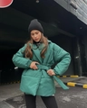 Detail of emerald green quilted jacket with matching fabric belt and waist cinching - S / Green