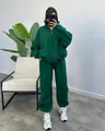 Detailed macro view of deep green oversized tracksuit featuring a stand collar and joggers - S / Dark Green