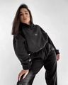 Detail of black fleece tracksuit showing half-zip collar and white chest logo - S / Black