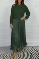 Detail of forest green knitted long sleeve top and pleated skirt with silk texture - Green