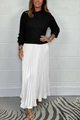 Detail of elegant black ribbed knit top and white pleated maxi skirt for casual wear - Black and White