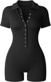 Dettaglio body nero a costine con colletto polo e bottoni a pressione color argento - S / Nero