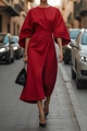 Detail of red elegant maxi dress featuring stylish puff sleeves and fitted waist design - Red