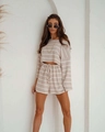 Detail of knitted striped two-piece set featuring cropped long sleeve top and drawstring shorts - S / Lotus root pink