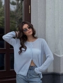 Detail of light blue knit cardigan featuring sheer texture and single-breasted button closure - S / Light Blue