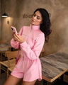 Close-up of pink velvet two-piece set featuring stand collar half-zip and side stripes - S / Pink