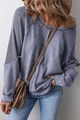 Detail of blue-grey waffle knit texture and washed fabric panels on a casual long-sleeve tee - Dark Blue