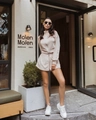 Close-up of beige two-piece lounge set with stand collar jacket and high waist shorts - S / Apricot