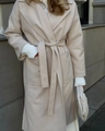 Detailed view of beige wool coat featuring wide lapels and a matching tie belt - S / Off White