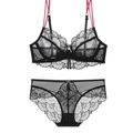 Detail of black lace lingerie set featuring red straps and sheer floral embroidery - 70A / Top And Bottom / Black