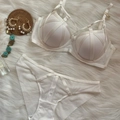 White lingerie set with cross-strap bra and mesh panties on white plush background - 70B / Top And Bottom / White