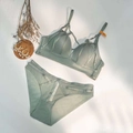 Flat lay of light sage green lingerie set with cross strap details and mesh panels - 70B / Grey Green