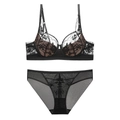 Französisches Spitzenunterwäsche-Set mit floraler Stickerei und stützendem BH - 75B / Schwarz/Hautfarben
