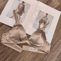 Detailed view of champagne satin bra with fabric composition tag and thin straps - XL / Khaki