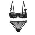 Completo intimo in pizzo nero trasparente con reggiseno a ferretto e slip con fiocco - 70A / Nero