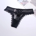 Close-up of black sheer mesh thong with delicate eyelash lace and crossover strap details - M / Bottoms / Black