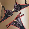 Set lingerie sexy in rete nera con ricamo floreale e bordi a balze rossi - M / Nero