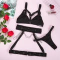 Three-piece black sexy lingerie set with metal chains and leg garters on pink background - S / Black
