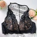 Vista dettagliata del ricamo floreale in pizzo nero e rete trasparente del reggiseno - S / Top Nero