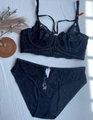 Detail view of black floral lace bra set with supportive underwire and sheer mesh fabric - 70B / Black
