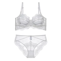 Detail showing white lace bra set with floral embroidery and size M washing label - 70B / White