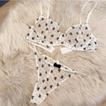 Détail de l'ensemble de lingerie en maille blanc cassé avec broderie nœuds noirs - S / Haut Et Bas / Blanc
