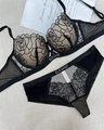 Detail of black rose lace lingerie set with elegant rhinestone lettering on a grey background - 75B / Top And Bottom / Black And Nude