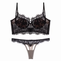 Detailed close-up of intricate black floral lace and adjustable straps on lingerie set - S / Black