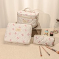 Three-piece quilted cotton cosmetic bag set with cute pink bow pattern and top handle - Small / White with Pink Bow